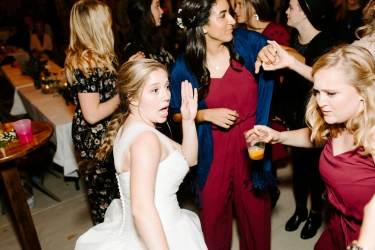 Bride dancing with bridesmaids